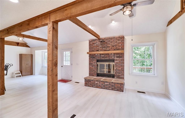 271 Westwood Trl, Foristell, MO 63348 - unfurnished living room with a ceiling fan, wood finished floors, and a brick fireplace