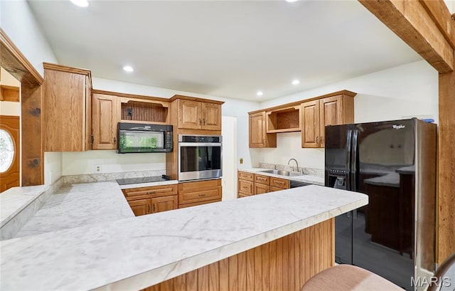 271 Westwood Trl, Foristell, MO 63348 - kitchen featuring open shelves, black appliances, recessed lighting, light countertops, and a peninsula
