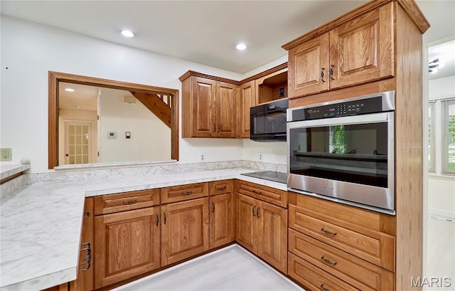 271 Westwood Trl, Foristell, MO 63348 - kitchen featuring black appliances, light countertops, brown cabinets, and open shelves