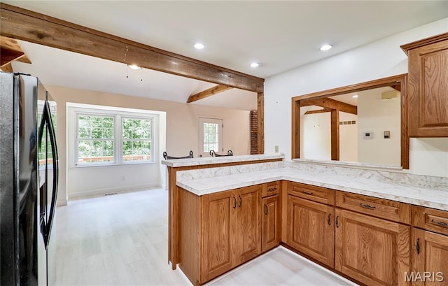 271 Westwood Trl, Foristell, MO 63348 - kitchen with freestanding refrigerator, brown cabinetry, light countertops, beamed ceiling, and recessed lighting