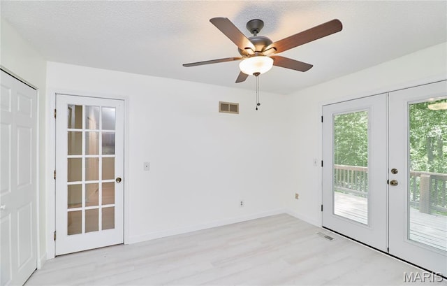 271 Westwood Trl, Foristell, MO 63348 - unfurnished room with french doors, light wood-style floors, and ceiling fan