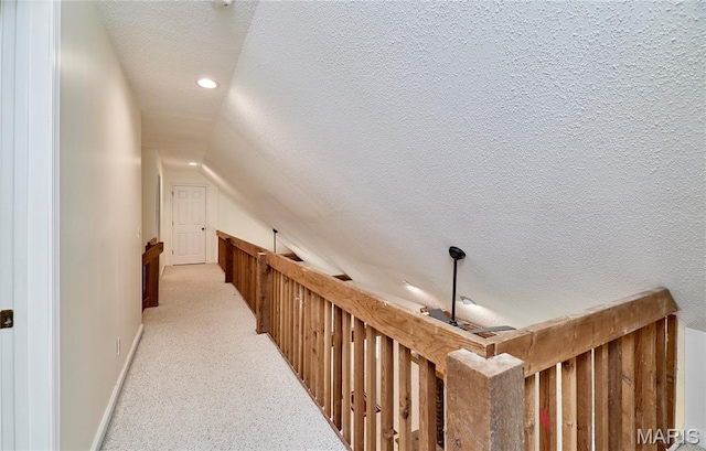 271 Westwood Trl, Foristell, MO 63348 - hallway featuring a textured ceiling, light carpet, vaulted ceiling, and recessed lighting