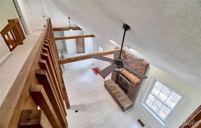 271 Westwood Trl, Foristell, MO 63348 - staircase featuring a textured ceiling, lofted ceiling, wood finished floors, and ceiling fan
