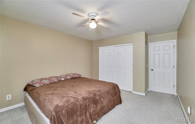 271 Westwood Trl, Foristell, MO 63348 - bedroom with carpet floors, a closet, a textured ceiling, and a ceiling fan