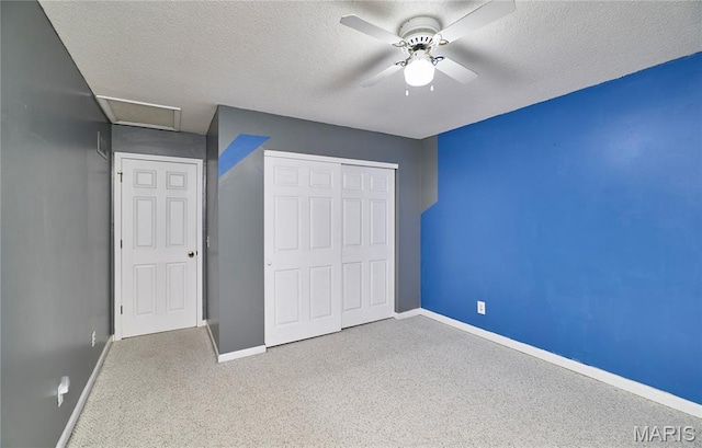 271 Westwood Trl, Foristell, MO 63348 - unfurnished bedroom featuring a textured ceiling, a closet, carpet floors, attic access, and a ceiling fan