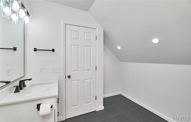 271 Westwood Trl, Foristell, MO 63348 - bathroom featuring lofted ceiling, vanity, tile patterned flooring, and recessed lighting