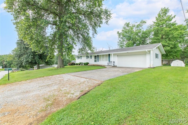 457 Maple Dr, Bethalto, IL 62010 - ranch-style home with concrete driveway, an attached garage, a front yard, and a storage shed