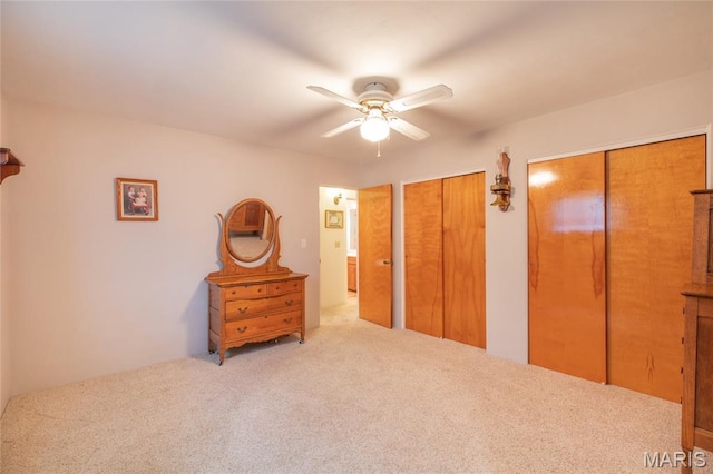 457 Maple Dr, Bethalto, IL 62010 - bedroom featuring multiple closets, carpet, and ceiling fan