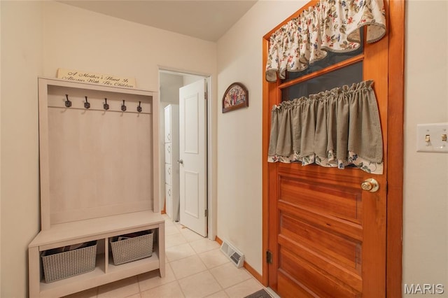 457 Maple Dr, Bethalto, IL 62010 - mudroom with light tile patterned floors and baseboards