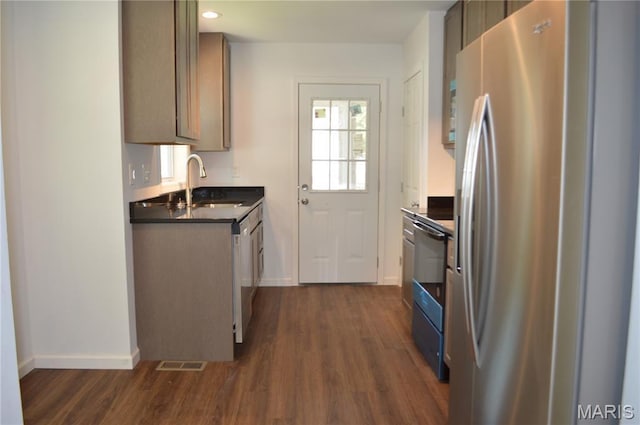 834 Vine St, Festus, MO 63028 - kitchen featuring stainless steel appliances, dark countertops, dark wood-style floors, and recessed lighting
