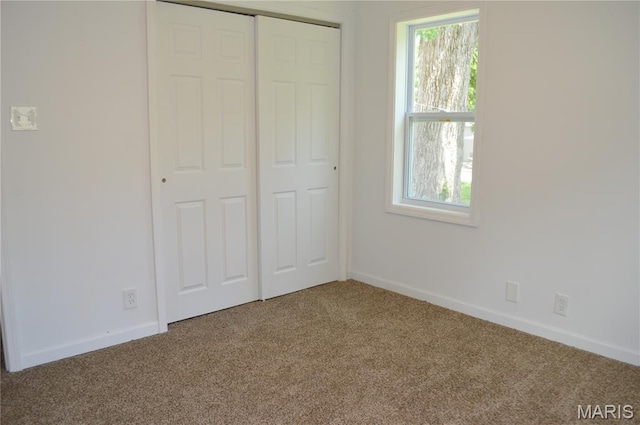 834 Vine St, Festus, MO 63028 - unfurnished bedroom featuring carpet, multiple windows, and a closet