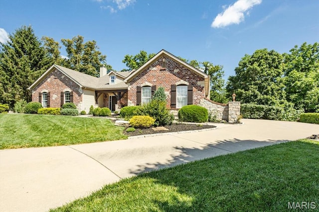 886 Arbor Chase Dr, Wildwood, MO 63021 - traditional-style house with brick siding, a front lawn, and a chimney