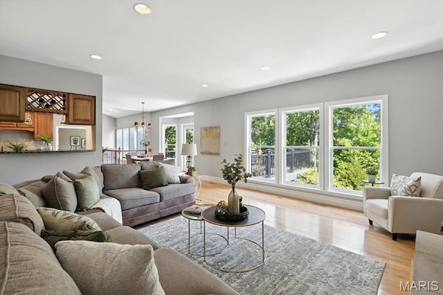 886 Arbor Chase Dr, Wildwood, MO 63021 - living room with recessed lighting, a chandelier, and light wood-style floors