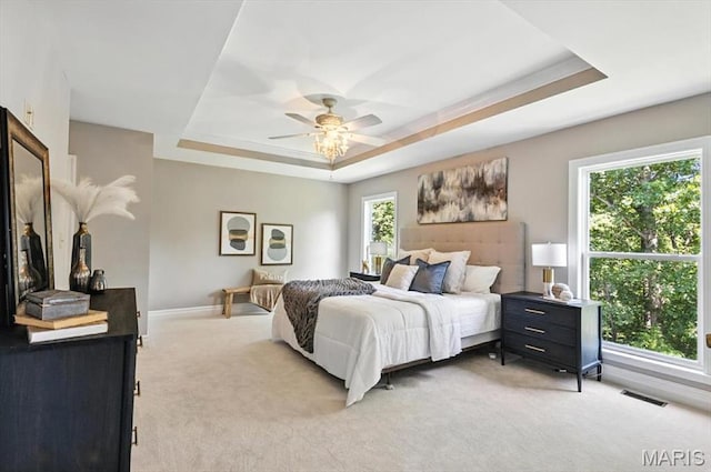 886 Arbor Chase Dr, Wildwood, MO 63021 - bedroom featuring a raised ceiling, light carpet, and a ceiling fan