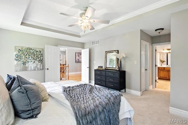 886 Arbor Chase Dr, Wildwood, MO 63021 - bedroom featuring a tray ceiling, light carpet, crown molding, ensuite bathroom, and ceiling fan