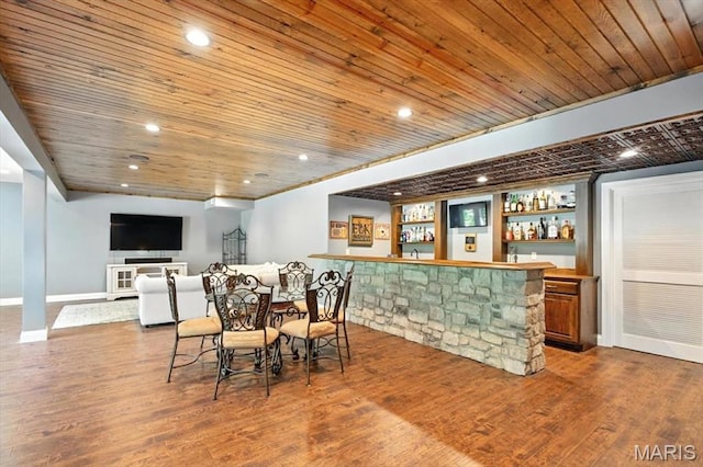 886 Arbor Chase Dr, Wildwood, MO 63021 - dining area featuring wooden ceiling, bar, wood finished floors, built in shelves, and recessed lighting