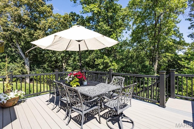 886 Arbor Chase Dr, Wildwood, MO 63021 - wooden terrace featuring outdoor dining space and view of wooded area