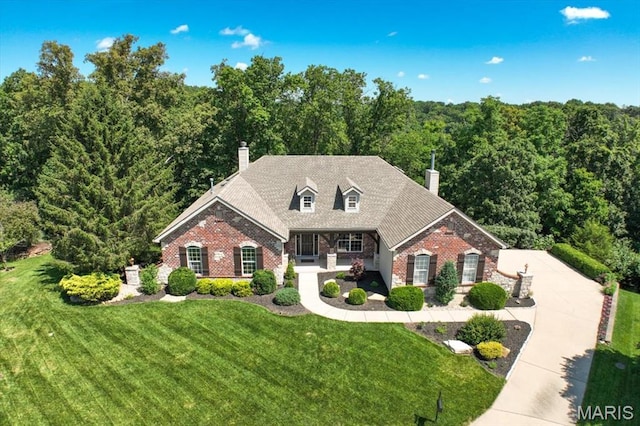 886 Arbor Chase Dr, Wildwood, MO 63021 - cape cod house featuring brick siding, a chimney, and a front yard