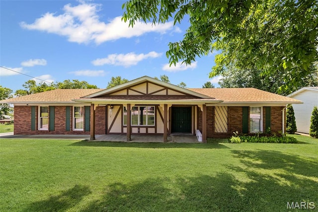 3 Noel Ln, Highland, IL 62249 - view of front of property featuring a front lawn, brick siding, covered porch, and a shingled roof