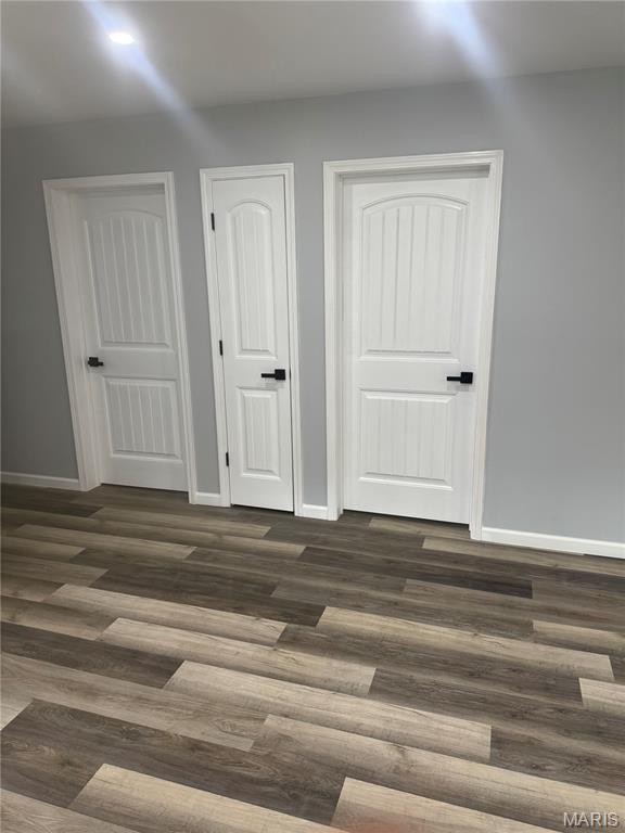 420 Evans Row, Park Hills, MO 63601 - unfurnished bedroom featuring dark wood-style flooring