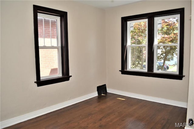 4521 Tholozan Ave, Saint Louis, MO 63116 - spare room featuring dark wood-type flooring