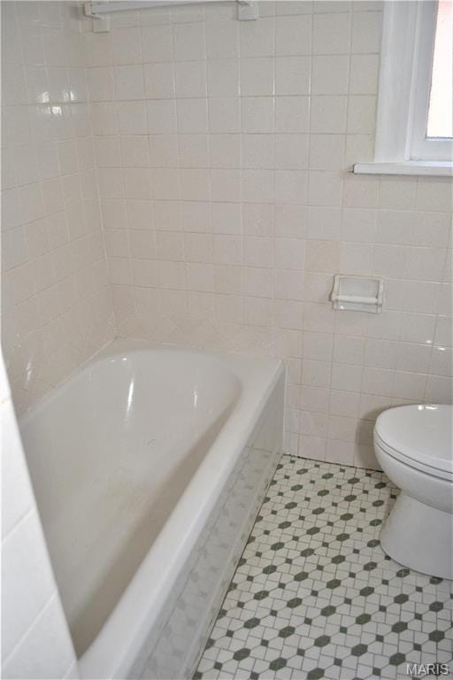 4521 Tholozan Ave, Saint Louis, MO 63116 - full bathroom with a tub, tile walls, and tile patterned floors
