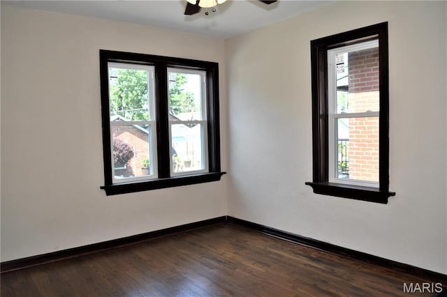 4521 Tholozan Ave, Saint Louis, MO 63116 - unfurnished room featuring dark wood-type flooring and ceiling fan