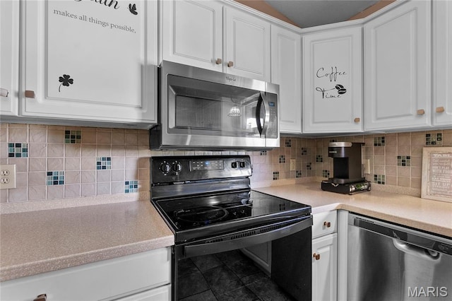 1133 Cypress Ct, Cape Girardeau, MO 63701 - kitchen with appliances with stainless steel finishes, white cabinetry, light countertops, and backsplash