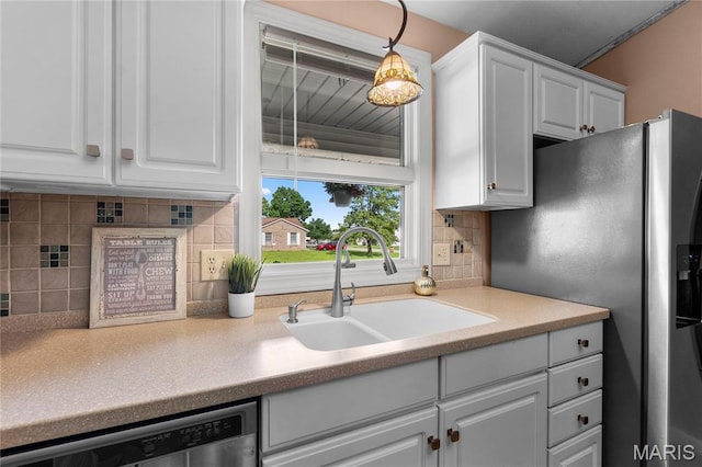 1133 Cypress Ct, Cape Girardeau, MO 63701 - kitchen featuring appliances with stainless steel finishes, white cabinets, backsplash, and light countertops
