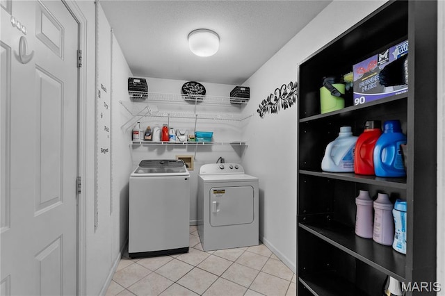 1133 Cypress Ct, Cape Girardeau, MO 63701 - laundry area featuring separate washer and dryer and light tile patterned floors
