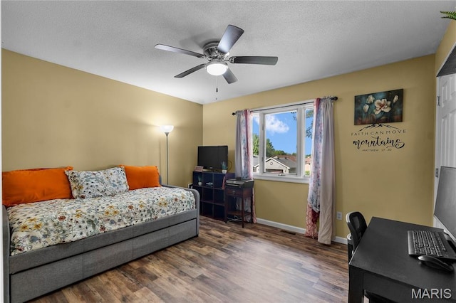 1133 Cypress Ct, Cape Girardeau, MO 63701 - bedroom featuring wood finished floors, an office area, a ceiling fan, and a textured ceiling