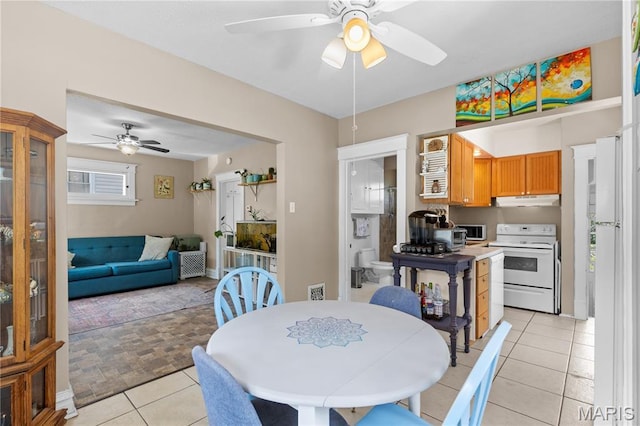 10225 Driver Ave, Overland, MO 63114 - dining room featuring a ceiling fan and light tile patterned flooring