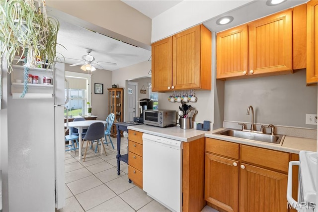 10225 Driver Ave, Overland, MO 63114 - kitchen featuring dishwasher, ceiling fan, light tile patterned floors, light countertops, and recessed lighting