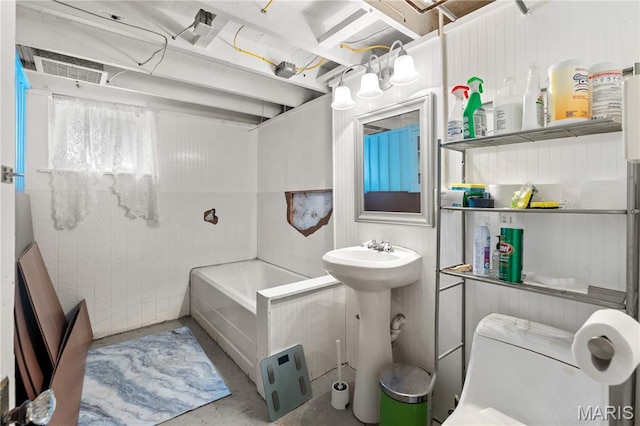10225 Driver Ave, Overland, MO 63114 - full bath with concrete flooring and a tub