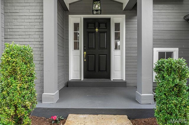 938 Blase Ave, Saint Louis, MO 63131 - view of exterior entry featuring covered porch
