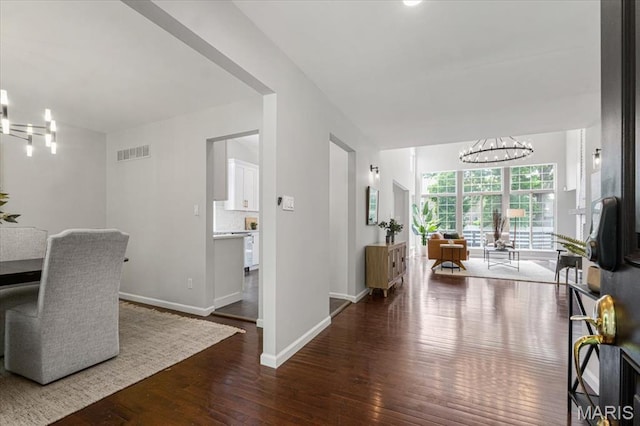 938 Blase Ave, Saint Louis, MO 63131 - dining space featuring a chandelier and hardwood / wood-style floors