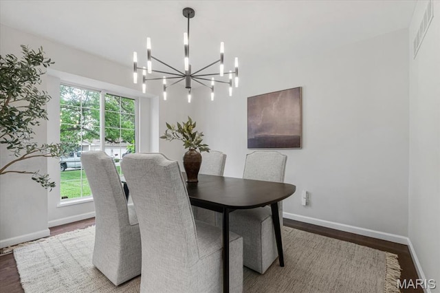 938 Blase Ave, Saint Louis, MO 63131 - dining area with wood finished floors and a chandelier