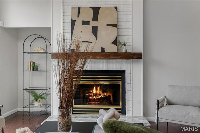 938 Blase Ave, Saint Louis, MO 63131 - detailed view of a brick fireplace and wood finished floors
