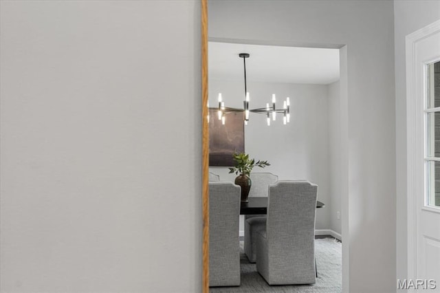 938 Blase Ave, Saint Louis, MO 63131 - dining area with a chandelier and baseboards