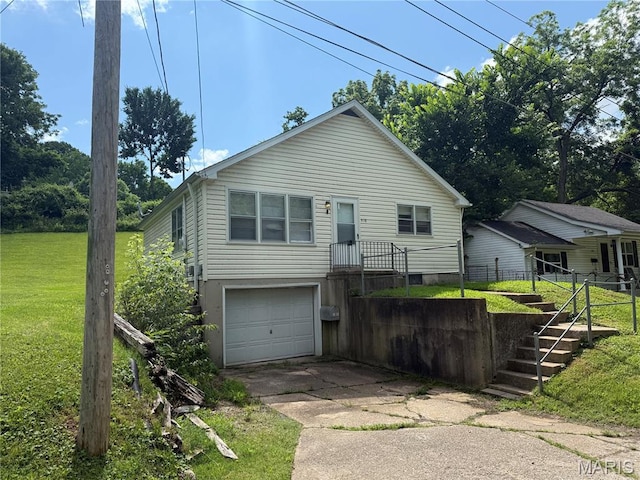 418 Monroe St, Pacific, MO 63069 - view of front of house featuring driveway, an attached garage, a front lawn, and stairs
