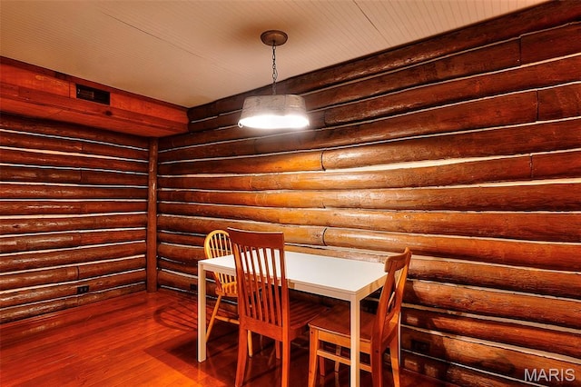 1369 County Highway 408, Benton, MO 63736 - dining room with dark wood-type flooring and log walls