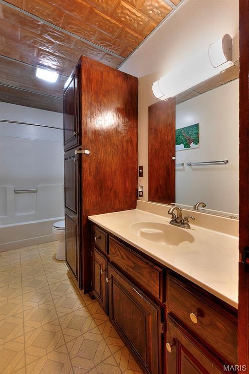 1369 County Highway 408, Benton, MO 63736 - bathroom featuring vanity, an ornate ceiling, and shower / tub combination