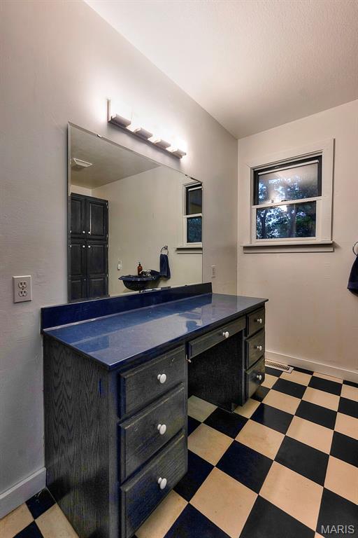 1369 County Highway 408, Benton, MO 63736 - bathroom with vanity and tile patterned floors