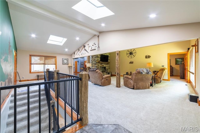 317 Johnson Pl, Palmyra, MO 63461 - carpeted living room with a skylight, a stone fireplace, and recessed lighting