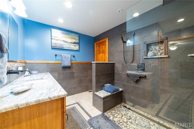 317 Johnson Pl, Palmyra, MO 63461 - bathroom with tile walls, walk in shower, vanity, and recessed lighting
