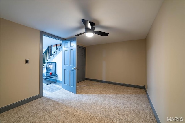 317 Johnson Pl, Palmyra, MO 63461 - empty room with light colored carpet, a ceiling fan, and stairs