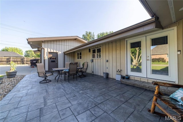 317 Johnson Pl, Palmyra, MO 63461 - view of patio featuring french doors and outdoor dining space