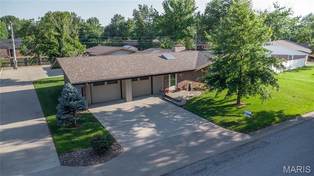 317 Johnson Pl, Palmyra, MO 63461 - view of front of house featuring roof with shingles, a garage, a front yard, and concrete driveway