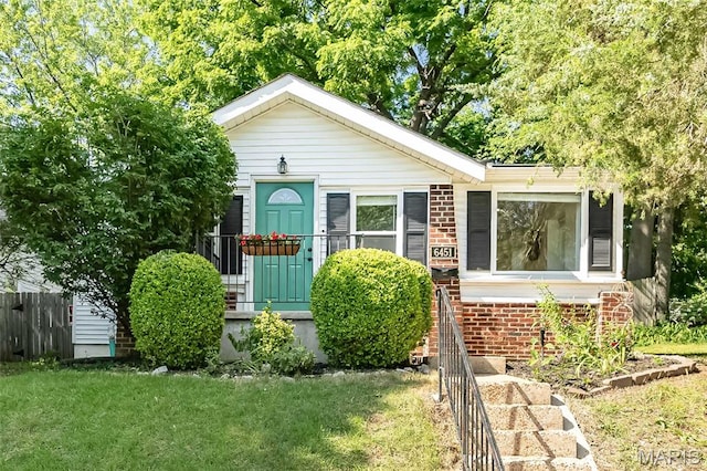 6451 Odell St, Saint Louis, MO 63139 - view of front of house featuring brick siding and a front lawn