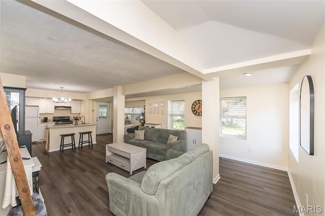 6451 Odell St, Saint Louis, MO 63139 - living room with a chandelier, dark wood-style floors, and vaulted ceiling